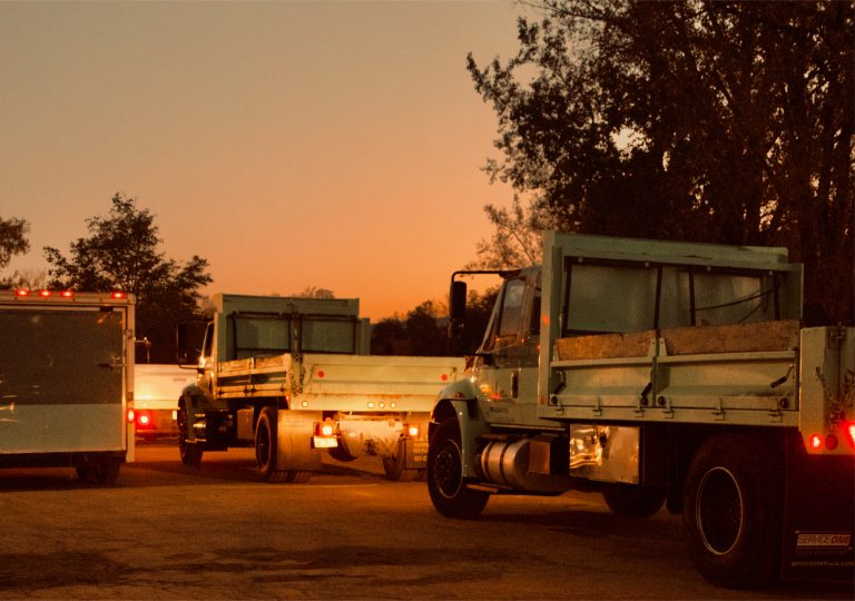 Mariani Landscape service trucks at sunset