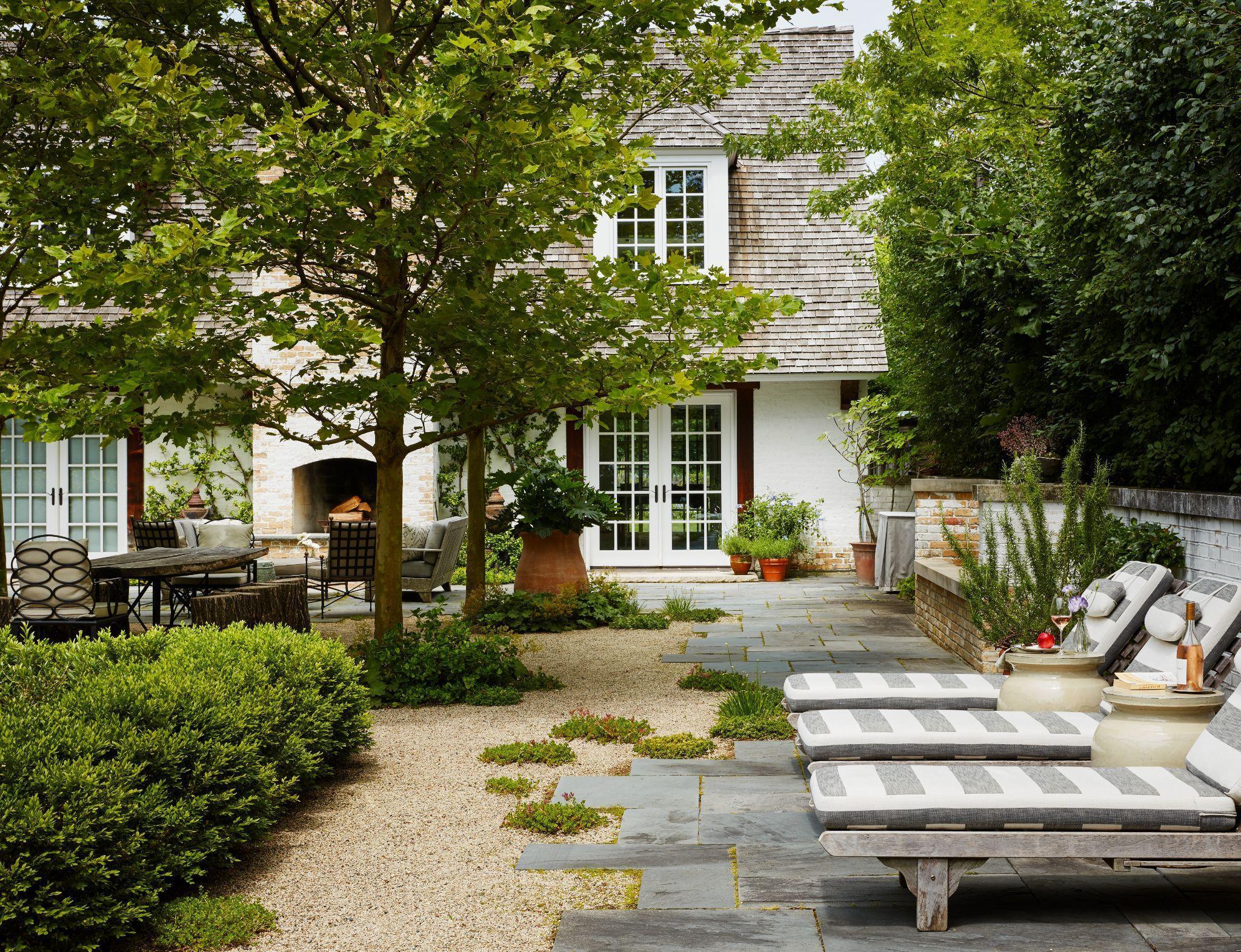 Traditional home patio with hydrangeas and outdoor seating
