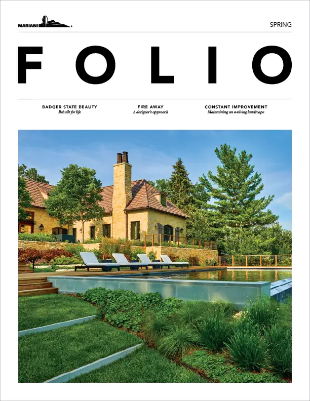 A landscaped backyard with a large house, a swimming pool, lounge chairs, and trees, featured on the cover of a magazine titled "Folio.